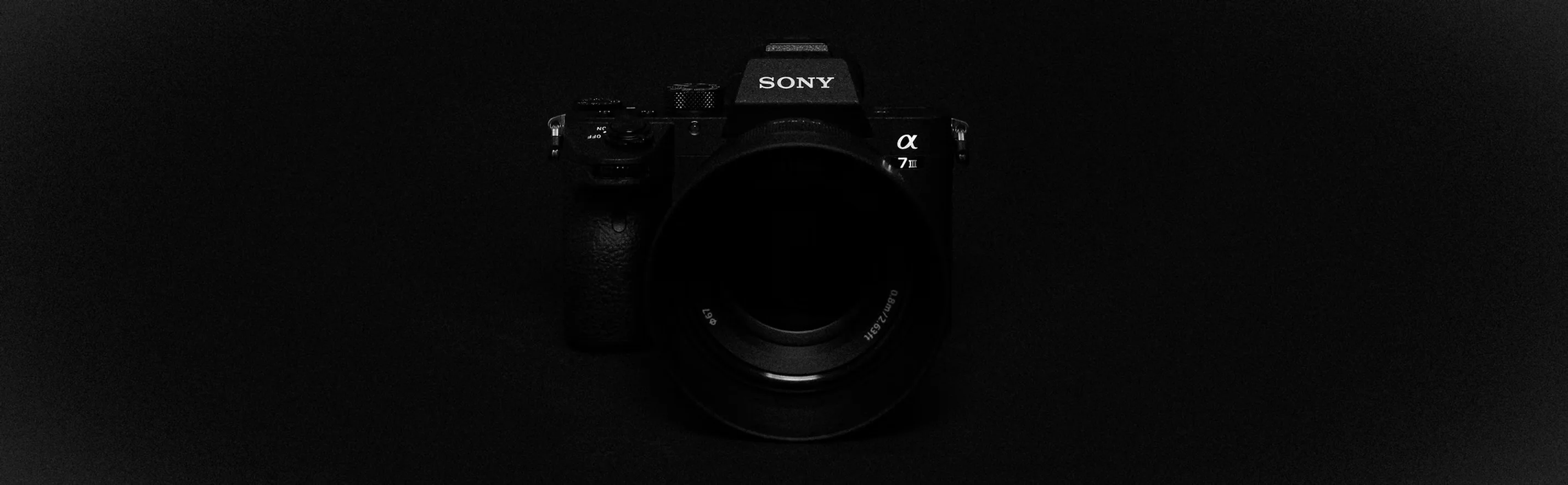 Sony Alpha 7 III mirrorless camera used by MEM Films, a video production company in Wentzville, MO, photographed head-on against a black background