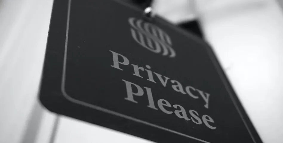 HIPAA-compliant medical video production: close-up of a Privacy Please door hanger sign