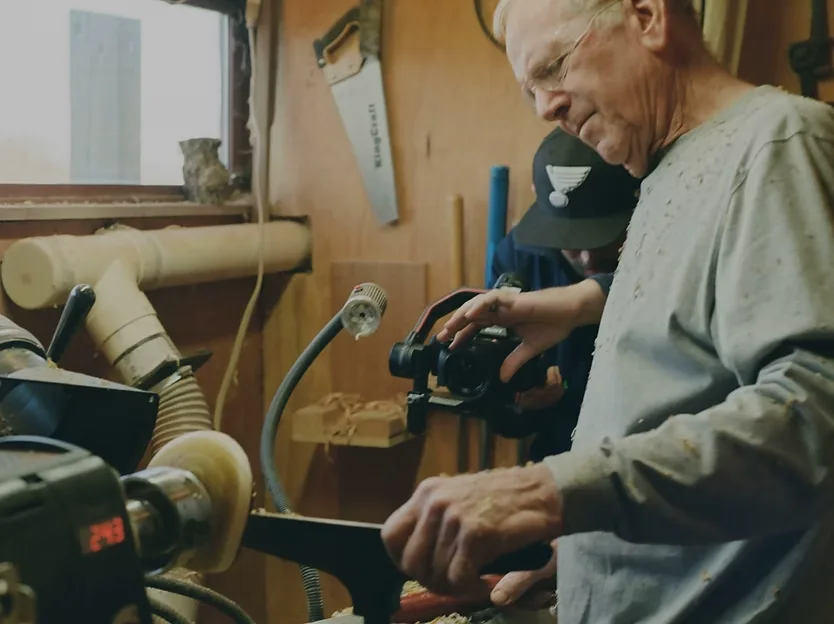 Brand video production for St. Peters, MO businesses: woodturner shaping a piece on a lathe while MEM Films films with a gimbal camera
