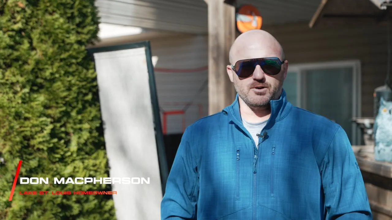 Exterior Cleaning Solutions testimonial: Don MacPherson in sunglasses and a blue quarter-zip interviewed outside