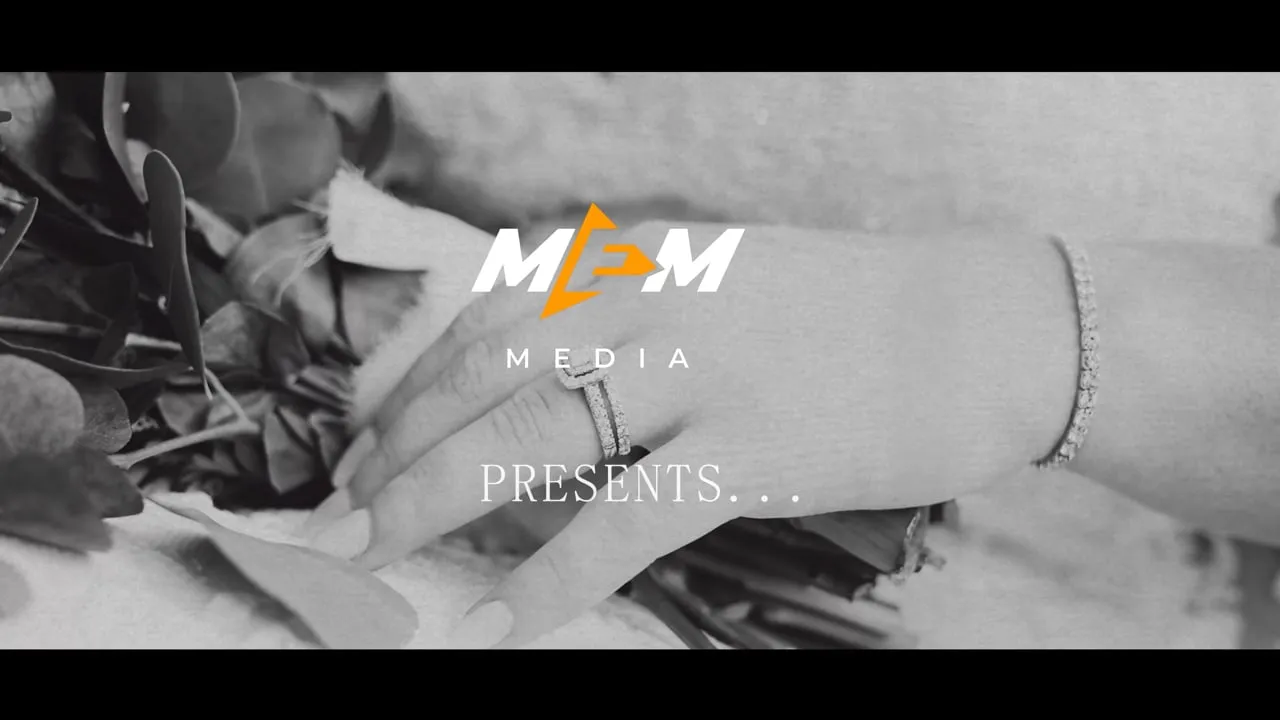 O'Fallon, MO wedding videographer reel: MEM Films presents title over a black and white close-up of a bride's hands and bracelet